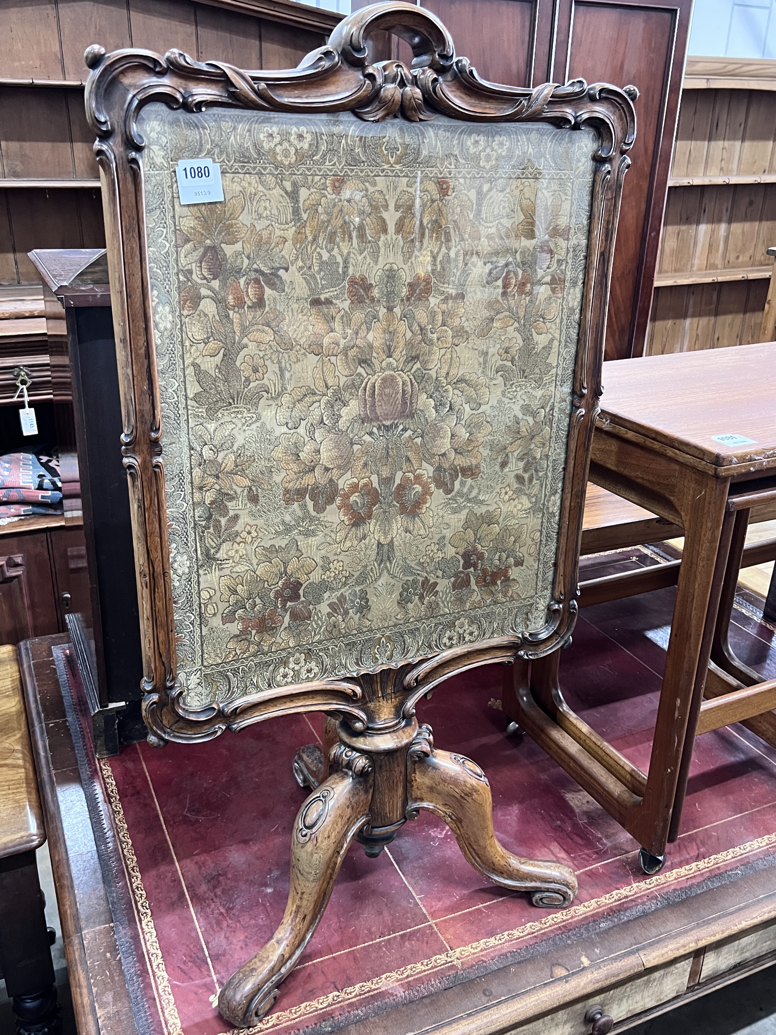 A Victorian carved rosewood firescreen with tapestry banner, width 58cm, height 106cm